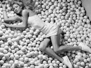 Anna Kournikova Poses On Tennis Balls For Sportswe