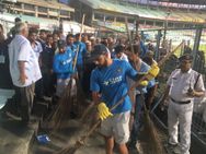 In Pics Virat Kohli Leads Cricketers Clean Eden Gardens Swachh Bharat