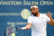 Baghdatis Advances As Winston Salem Open Stands Still Eclipse