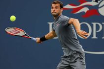 Federer Nadal Edge Through As Dimitrov Crashes Out