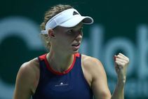 Wozniacki Battles Through Knee Complaint Down Kvitova
