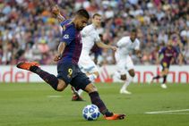 Suarez Helps Barcelona Stay On Top