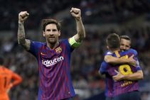 Five Players Watch In The Catalan Derby