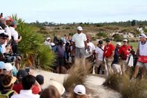 Woods Avoids Penalty Rahm Surges