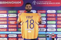 Icc World Cup 2019 Virat Kohli Unveils India S Orange Away Jersey