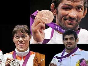 Medallists return to rousing welcome after historic exploits