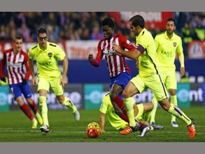 Late goal sends Atletico Madrid to top place in La Liga