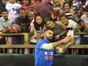 Virat Kohli takes selfies with fans after scoring 74 in warm-up T20 match