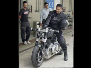 See pic: When MS Dhoni rode a policeman's bike in Zimbabwe!