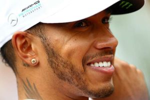 Humbled Hamilton hails Schumacher after equalling pole record