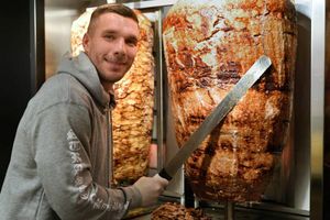 Fans wait in line as Podolski opens kebab shop