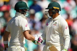Khawaja answers critics, Smith celebrates milestone to put Australia on top