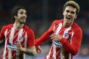 Griezmann's hat-trick helps Atletico pile pressure on Barcelona