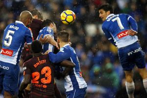 Pique keeps Barca unbeaten as Atletico trims lead
