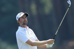Simpson ties course record for five-shot lead as Tiger survives but McIlroy misses cut