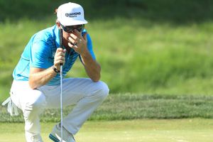 Woods makes move as three share Quicken Loans National lead