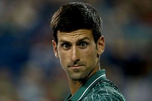 Djokovic overcomes illness to see off Mannarino