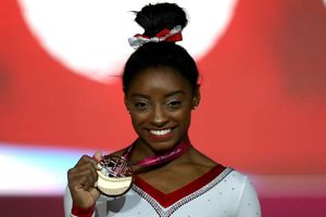 Brilliant Biles claims record 13th gold in Doha