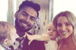 Safe pair of hands: When 'baby sitter' Pant took Paine's son in his lap