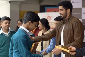 Boxer Vijender Singh interacts with underprivileged children at PokerBaazi welfare event