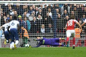 Premier League: Tottenham 1 Arsenal 1: Lloris' late penalty heroics give Spurs welcome relief
