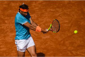 Nadal fights back to halt Mayer in Barcelona