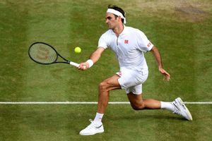Semi-final bound Federer makes history with 100th Wimbledon win