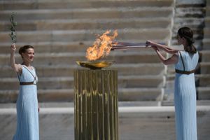 Japan welcomes Olympic flame as doubts swirl over Games