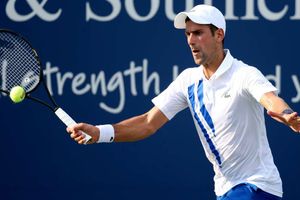 Djokovic sails through to quarters as Murray bows out
