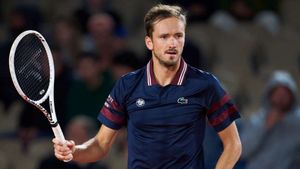 Medvedev battles into French Open second round after Koepfer triumph