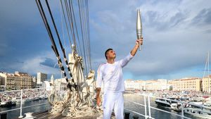 Olympic Flame Arrives in Marseille as Paris 2024 Torch Relay Gets Underway