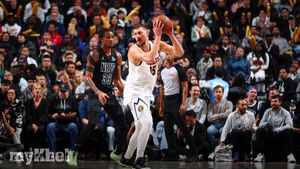 Jokic's Historic Triple-Double Propels Nuggets Past Nets In Overtime Thriller