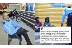 ఏటీఎం వెలుగులో ఓనమాలు దిద్దిస్తోన్న సెక్యూరిటీ గార్డు