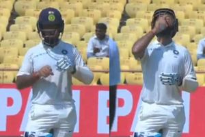 రాజ్‌కోట్‌లో ఎండవేడిమి: పుజారా జేబులో వాటర్ బాటిల్? (వీడియో)