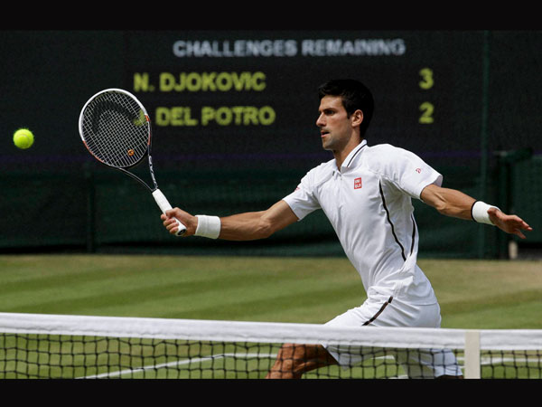 Novak Djokovic returns