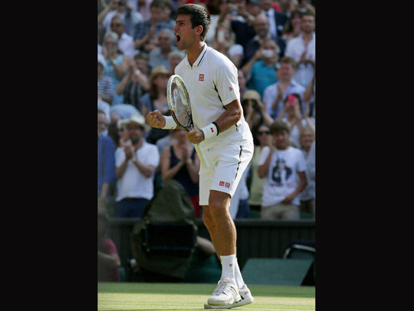 Djokovic reacts after entering the final
