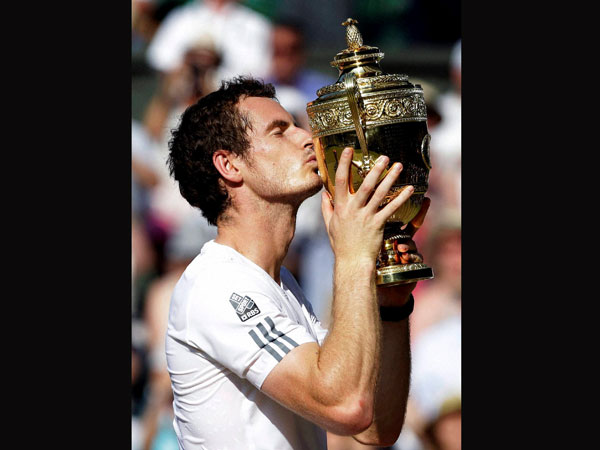 Andy Murray of Britain kisses the trophy