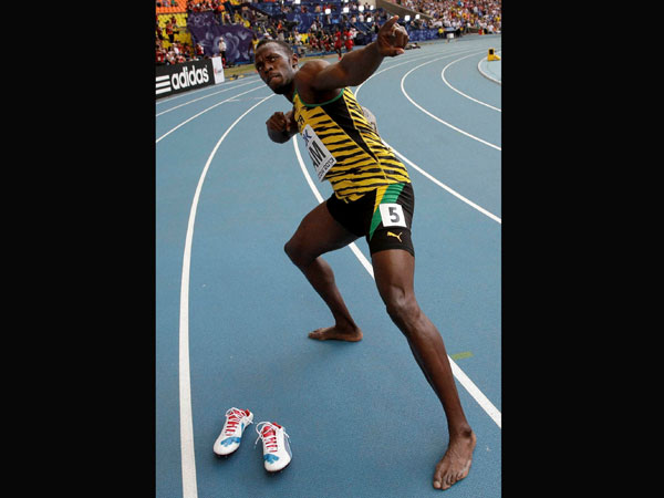 Jamaica's Usain Bolt celebrates winning his third gold medal