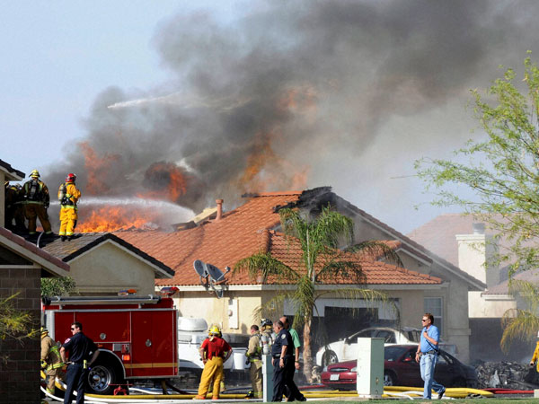 Military jet crashes in residential area 