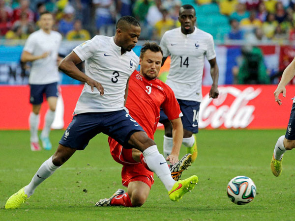 Switzerland's Haris Seferovic, right, challenges France's Patrice Evra