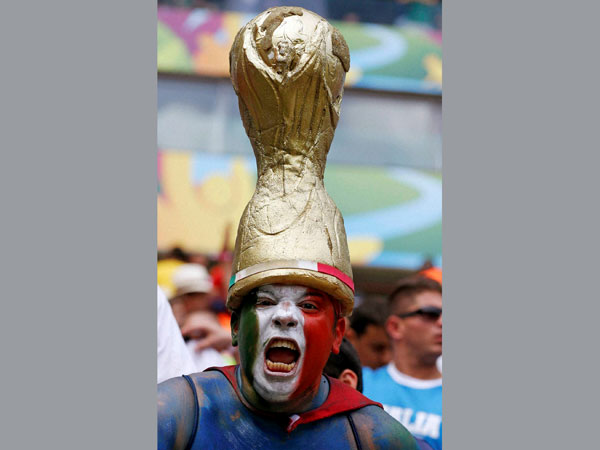 An Italian supporter reacts before the group D World Cup soccer