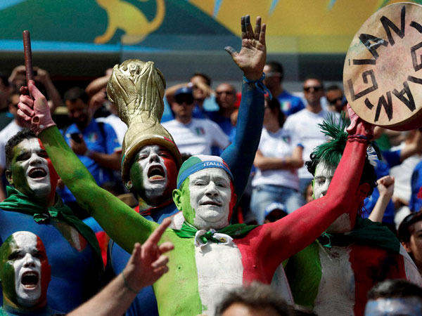Italian supporters react before the group D World Cup soccer match