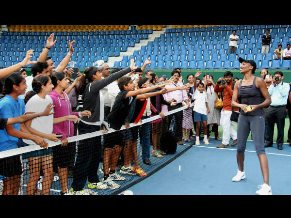 Venus Williams (right) of Bangalore Raptors obliges fans after a practice session at Karnataka State Lawn Tennis Association (KSLTA) court in Bengaluru on Wednesday