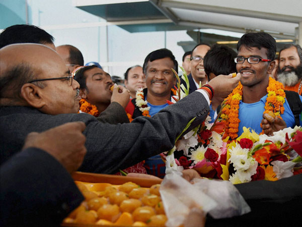 Indian blind cricket team being offered sweets