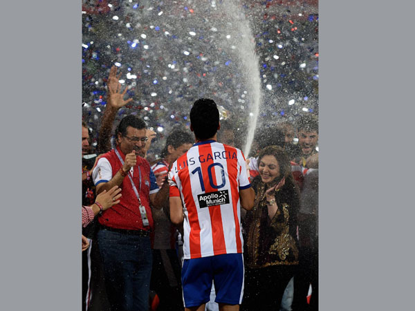 Atletico De Kolkata captain Luis Garcia sprays champagne on ISL founding chairperson Nita Ambani after winning the Indian Super League final match against Kerala Blaster FC in Navi Mumbai on Saturday Atletico De Kolkata captain Luis Garcia sprays champagne on ISL founding chairperson Nita Ambani after winning the Indian Super League final match against Kerala Blaster FC in Navi Mumbai on Saturday