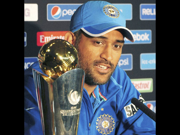 Dhoni with the Champions Trophy