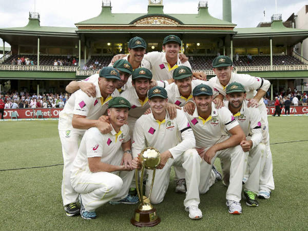 Australian players pose with the Border-Gavaskar trophy