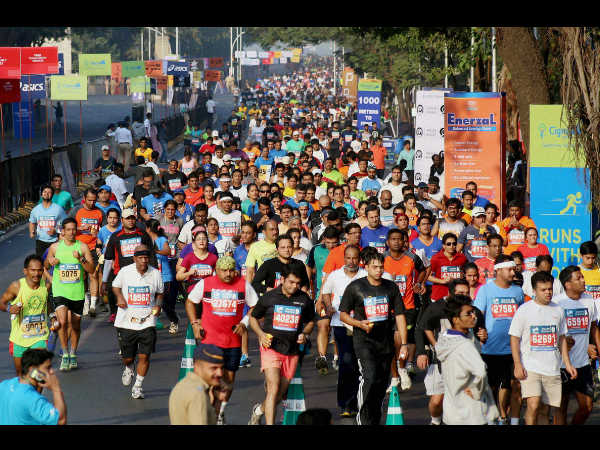 People participate in Standard Chartered marathon in Mumbai on Sunday.