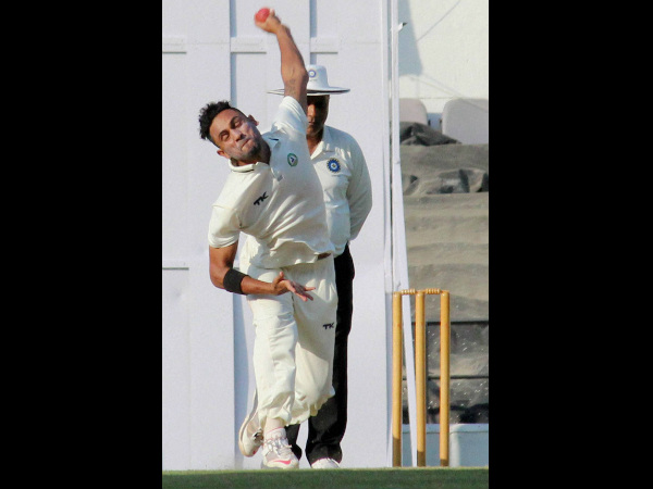 Shrikant Wagh bowls during the match. He took 3 wickets in 2nd innings
