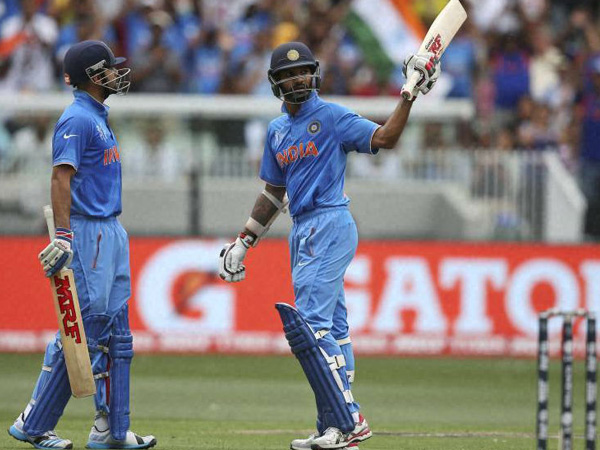 Shikhar Dhawan (right) gets to 50 and goes on to score 137